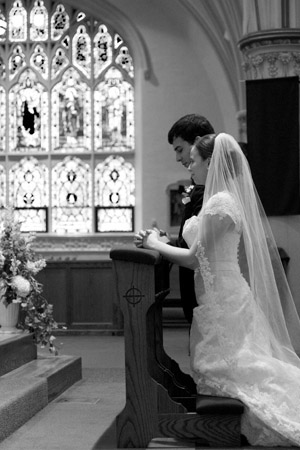 bride and groom at altar